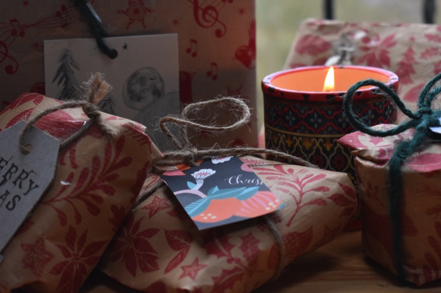 Wrapped gifts with a candle